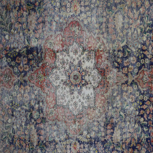 Detailed view of vintage Persian rug medallion featuring traditional Persian floral patterns