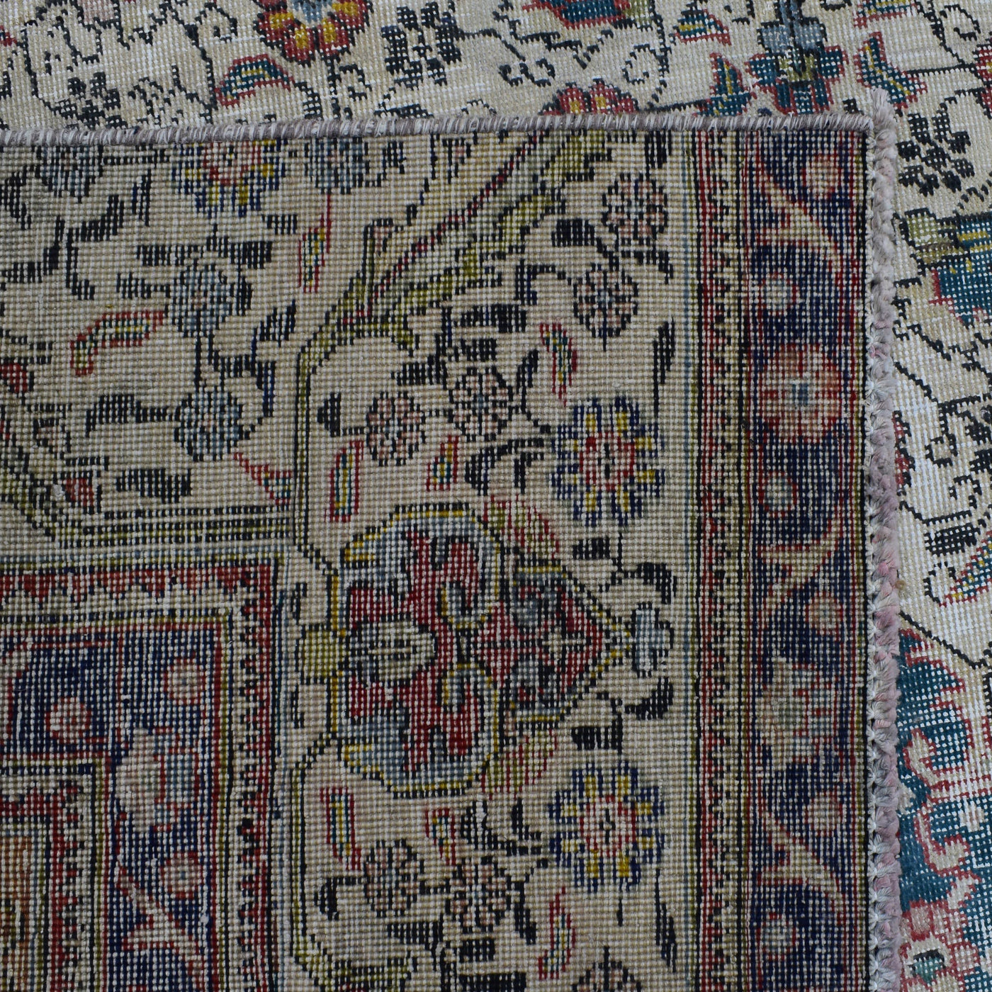 Backside of hand knotted Persian rug showing weave structure and authentic handmade construction