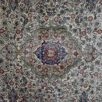 Detailed view of vintage Persian rug medallion featuring traditional Persian floral patterns on ivory field