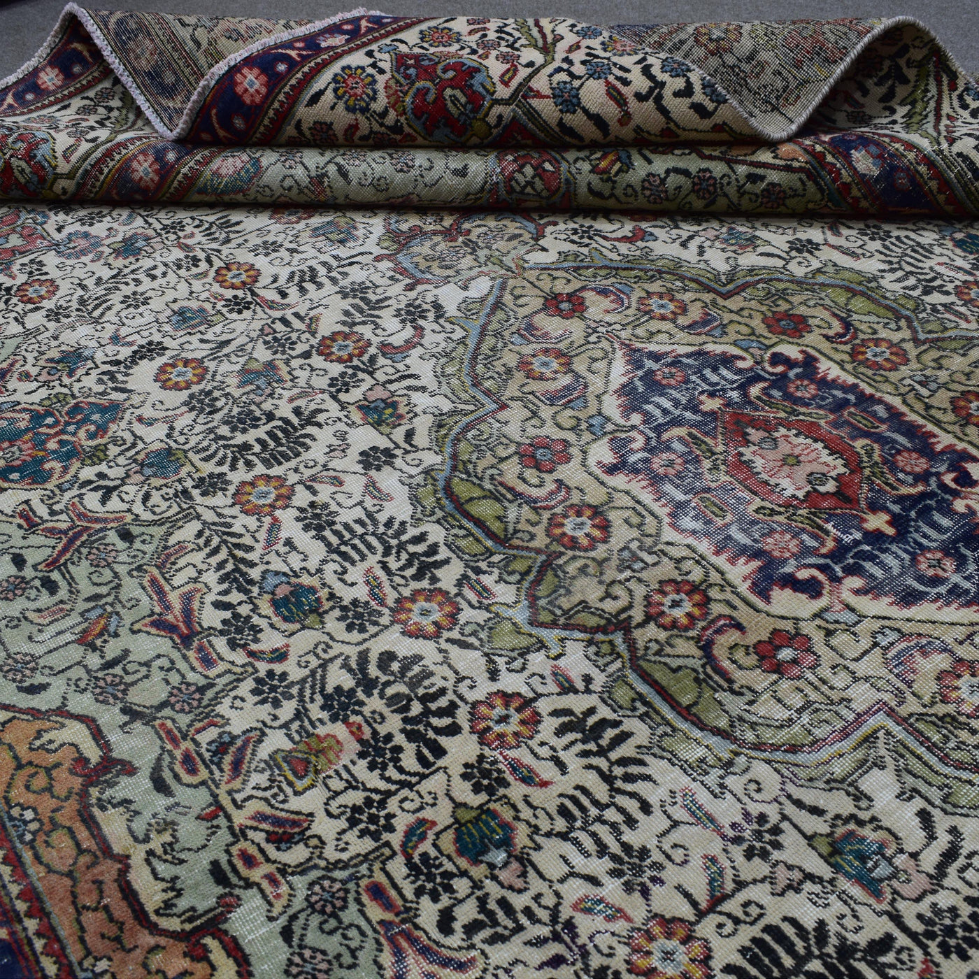 Macro detail of Persian rug pattern highlighting dense floral elements and wool texture