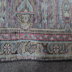 Backside of hand knotted Persian rug showing weave structure and authentic handmade construction