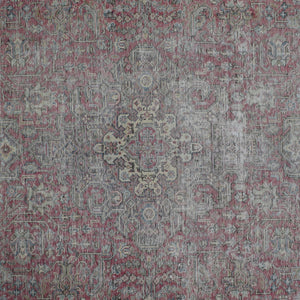 Detailed view of vintage Persian rug pattern featuring delicate medallion and floral elements