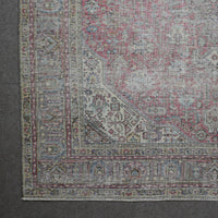 Corner detail of Persian rug with decorative border and traditional Persian motifs