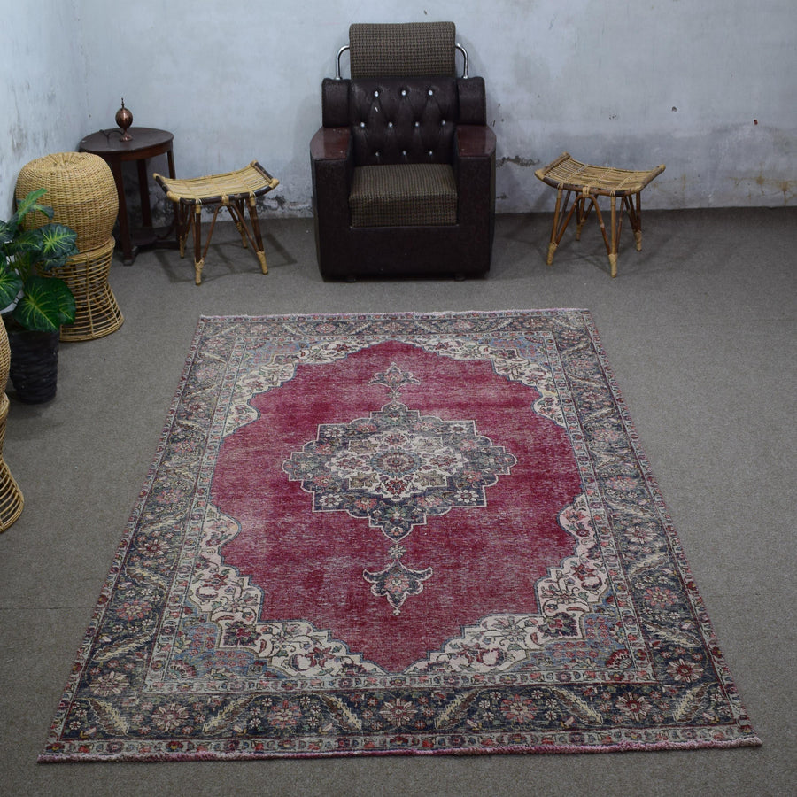 Vintage Persian rug 192x290 cm styled in interior showing deep red tones and classic medallion design