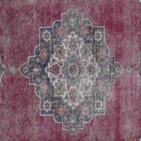 Detailed view of vintage Persian rug medallion featuring traditional Persian floral motifs