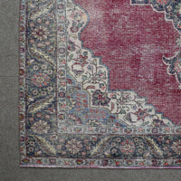 Corner detail of Persian rug with decorative border and classic Persian motifs