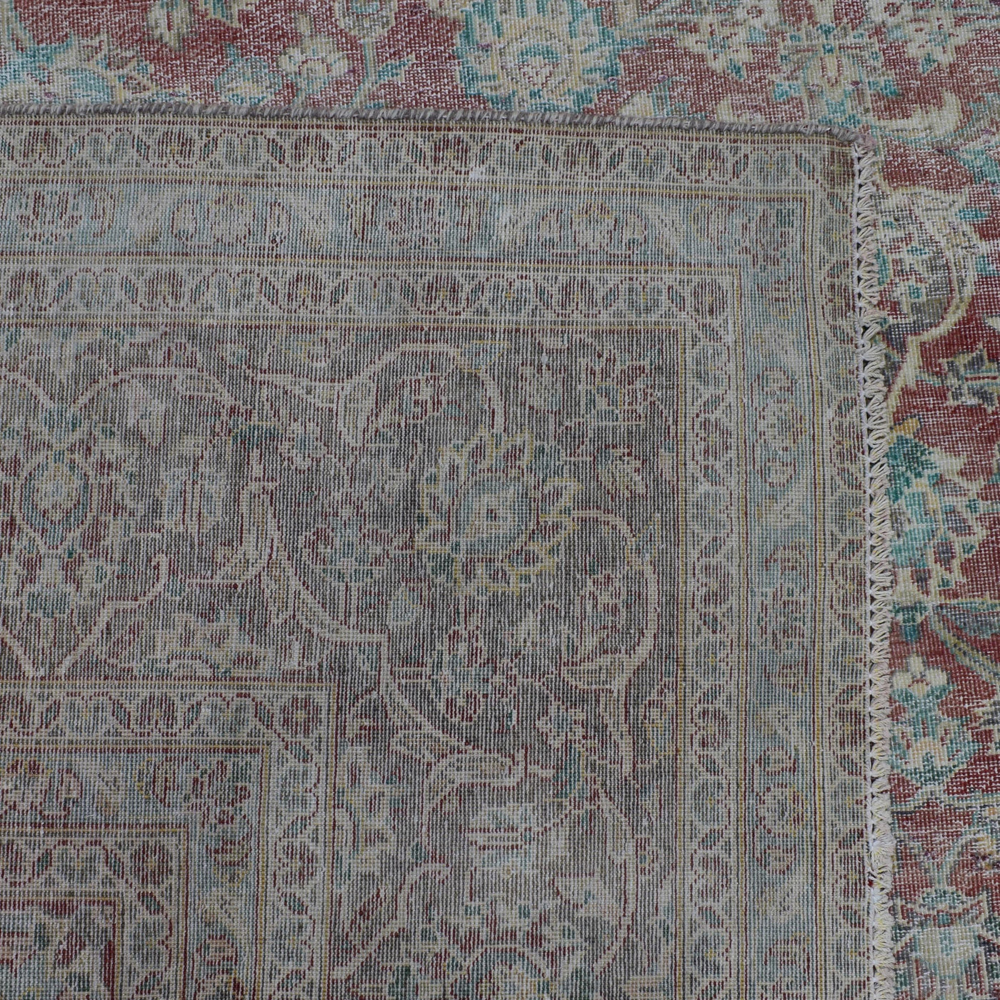 Backside of hand knotted Persian rug showing weave structure and authentic handmade construction