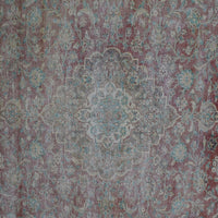 Detailed view of vintage Persian rug medallion featuring traditional Persian floral patterns