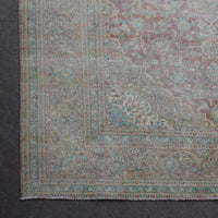 Corner detail of Persian rug with decorative border and classic Persian motifs
