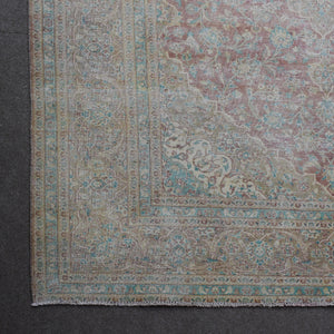 Corner detail of Persian rug with decorative border and classic Persian motifs