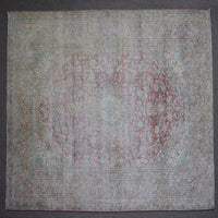 Close up of Persian rug border with colorful floral motifs and intricate guard stripes