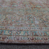 Macro detail of Persian rug medallion highlighting worn wool texture and faded design