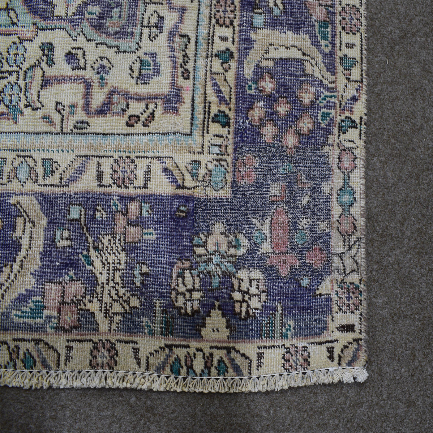 Backside of hand knotted Persian rug showing weave structure and authentic handmade construction