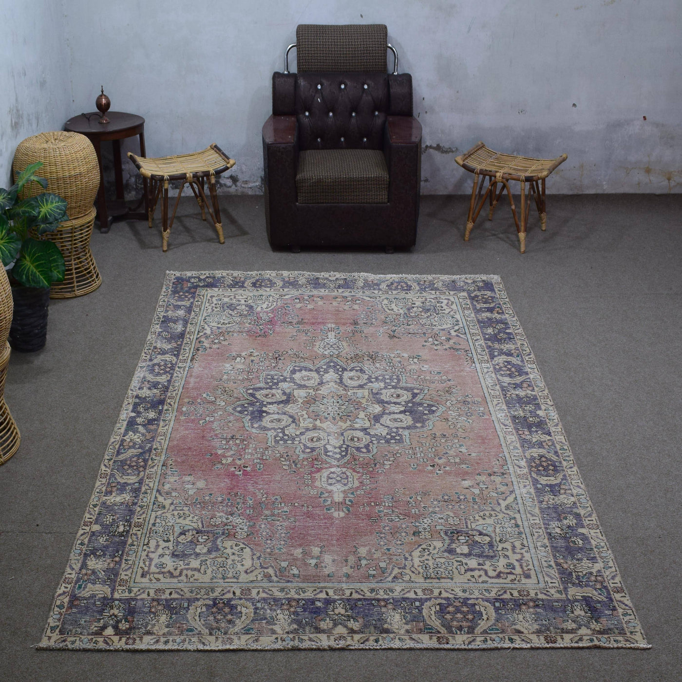 Vintage Persian rug 197x292 cm styled in interior showing rose background and classic medallion design