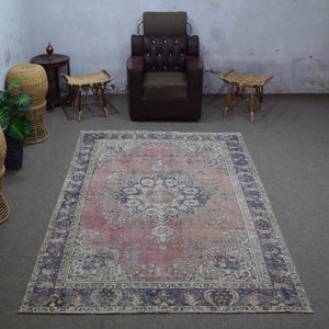 Vintage Persian rug 197x292 cm styled in interior showing rose background and classic medallion design