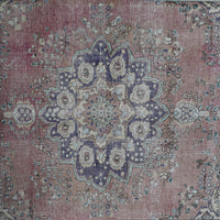 Detailed view of vintage Persian rug medallion featuring traditional Persian floral patterns