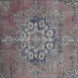 Detailed view of vintage Persian rug medallion featuring traditional Persian floral patterns
