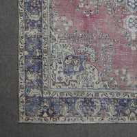 Corner detail of Persian rug with decorative border and classic Persian motifs