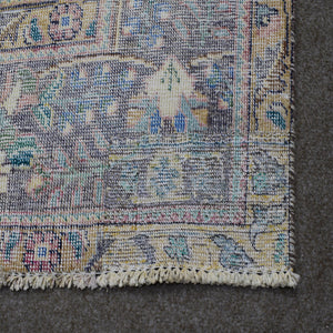 Backside of hand knotted Persian rug showing weave structure and authentic handmade construction