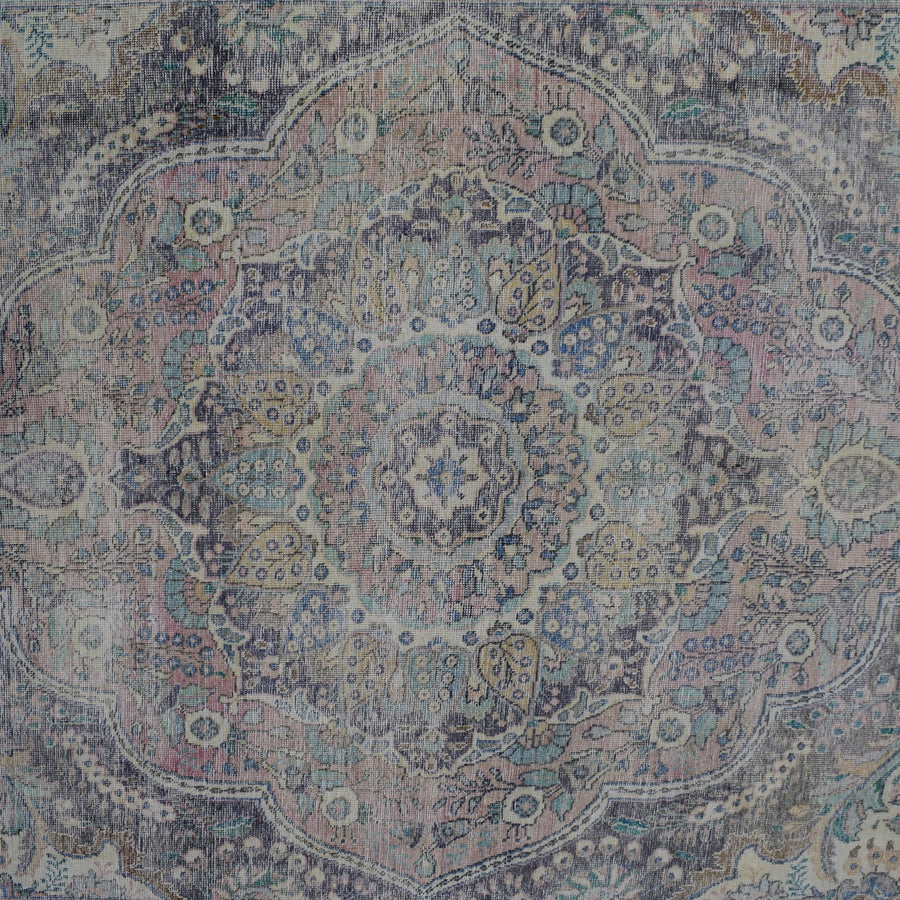 Detailed view of vintage Persian rug medallion featuring traditional Persian floral patterns