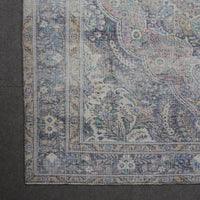 Detailed view of vintage Persian rug medallion featuring traditional Persian floral patterns