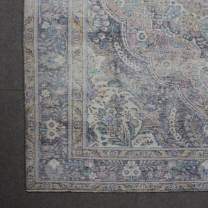 Detailed view of vintage Persian rug medallion featuring traditional Persian floral patterns