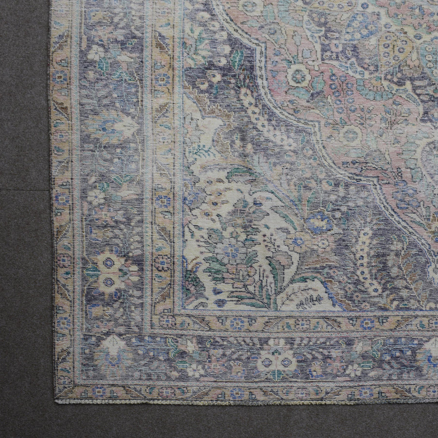 Detailed view of vintage Persian rug medallion featuring traditional Persian floral patterns