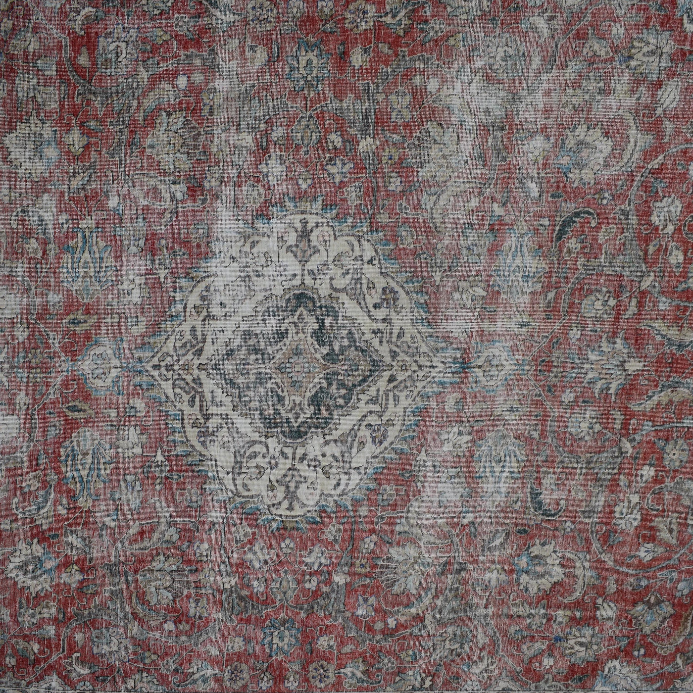 Detailed view of vintage Persian rug medallion featuring traditional Persian floral motifs