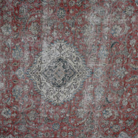Detailed view of vintage Persian rug medallion featuring traditional Persian floral motifs