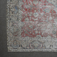 Corner detail of Persian rug with decorative border and classic Persian motifs