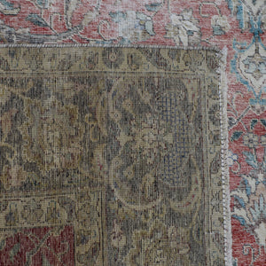Macro detail of Persian rug pattern highlighting worn wool texture and faded design