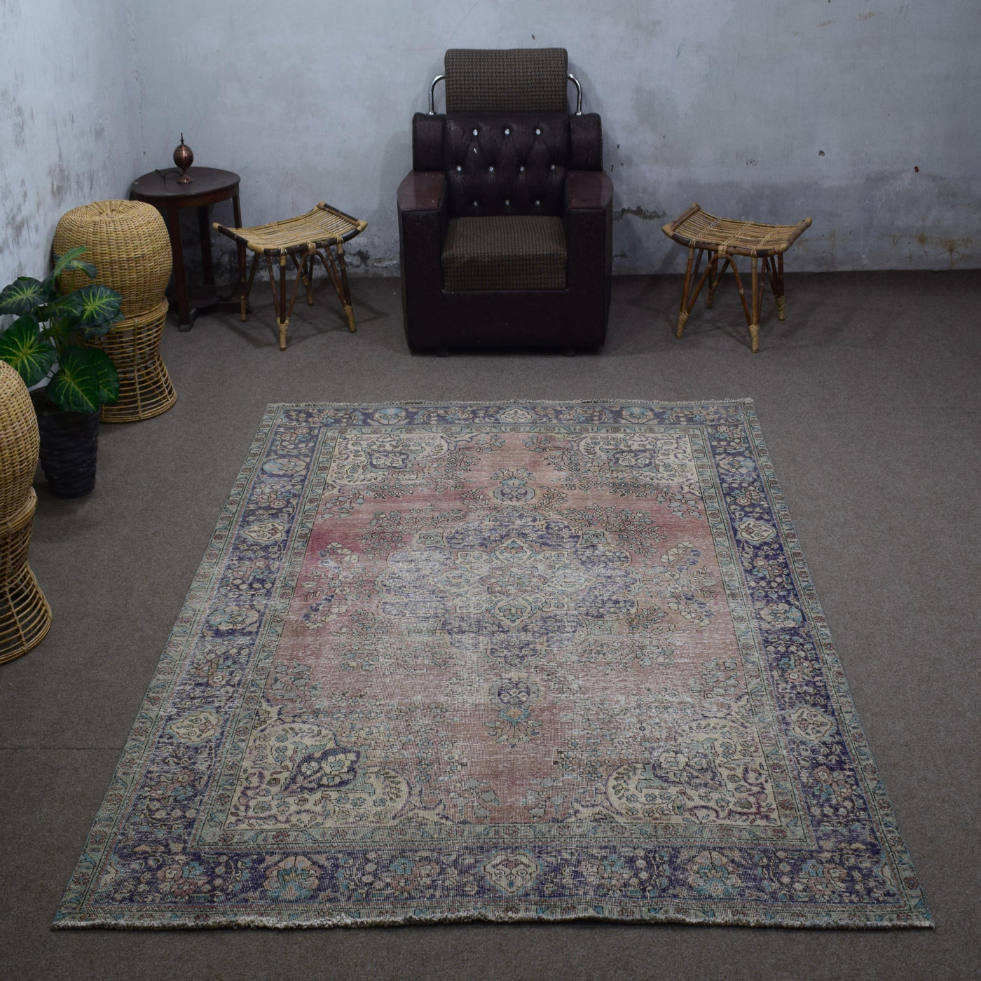 Vintage Persian rug 203x280 cm photographed in interior setting showing distressed pastel tones and central medallion