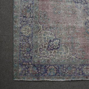 Corner detail of vintage Persian rug showing decorative border and classic Persian motifs