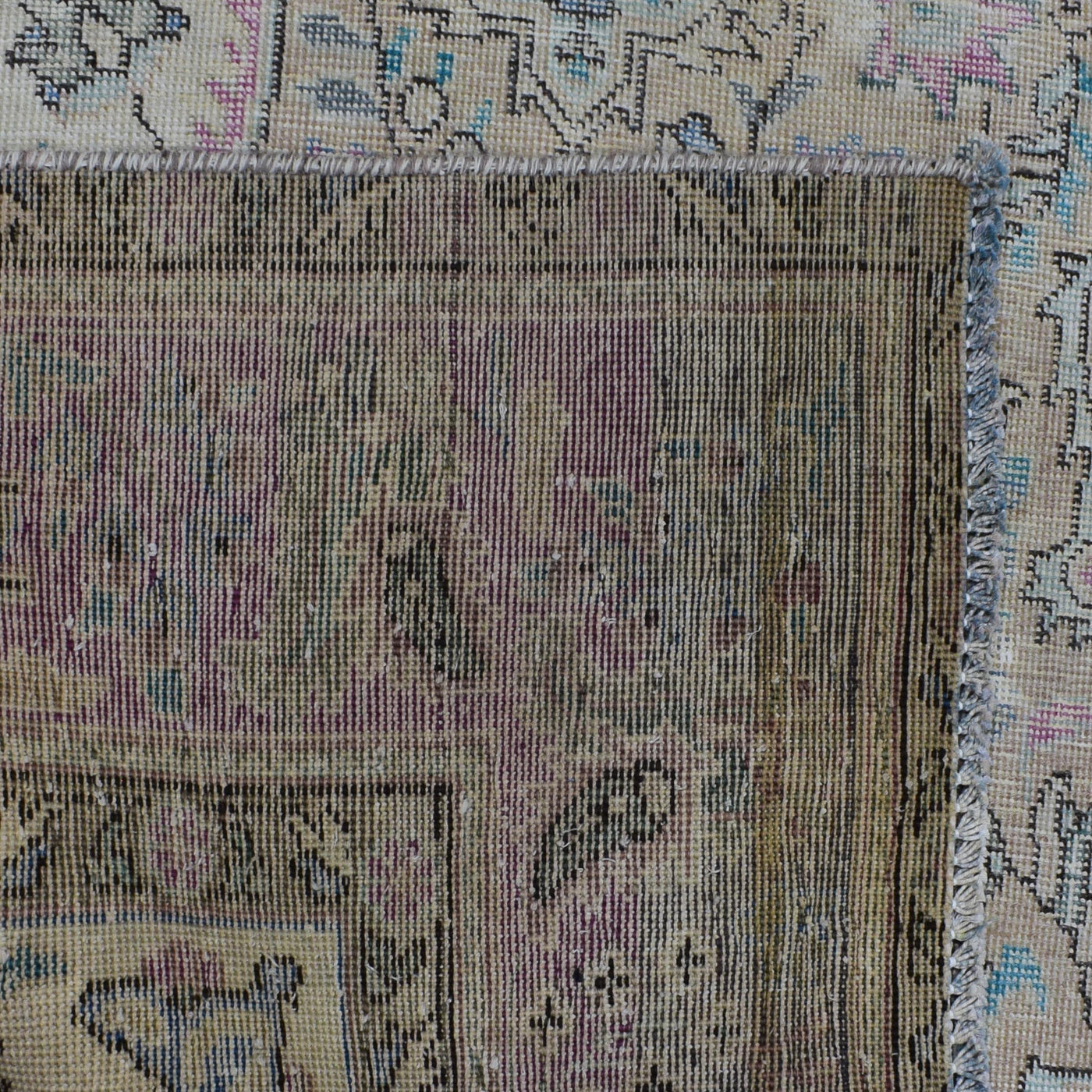 Detailed section of Persian rug field and border showing traditional Persian floral pattern