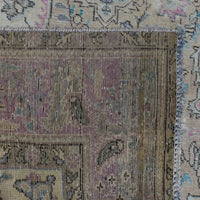 Detailed section of Persian rug field and border showing traditional Persian floral pattern