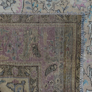 Detailed section of Persian rug field and border showing traditional Persian floral pattern