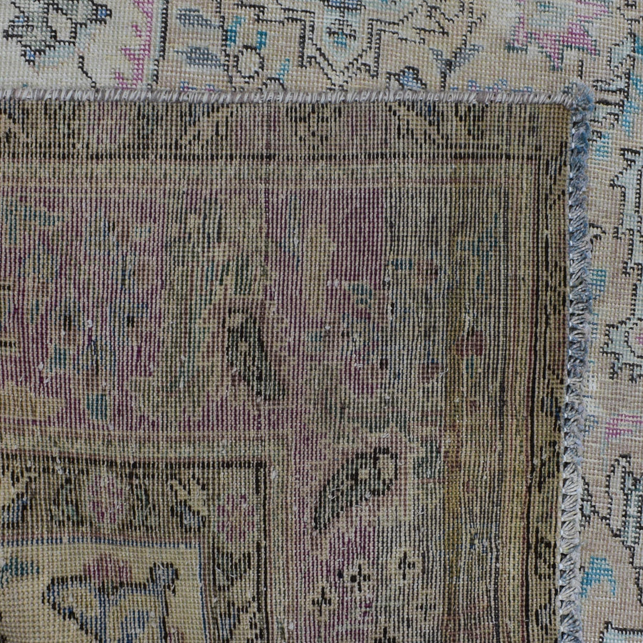 Detailed section of Persian rug field and border showing traditional Persian floral pattern