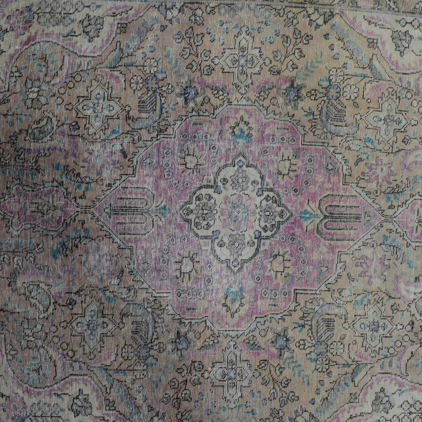 Detailed view of vintage Persian rug center pattern with traditional Persian floral design