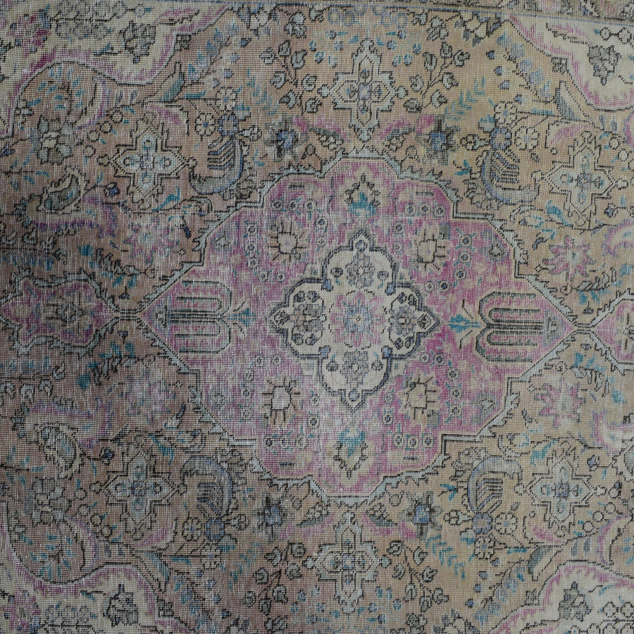 Detailed view of vintage Persian rug center pattern with traditional Persian floral design