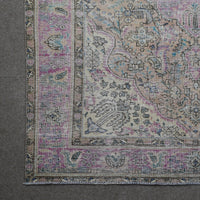 Corner detail of Persian rug showing decorative border and intricate floral elements
