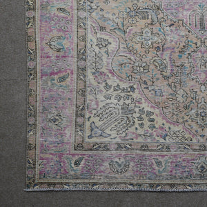 Corner detail of Persian rug showing decorative border and intricate floral elements