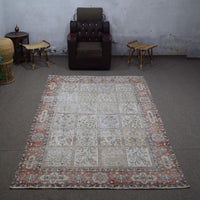 Vintage Persian patchwork rug 200x305 cm photographed in interior setting showing panel motif layout