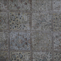 Detailed view of vintage Persian rug patchwork design with multiple decorative squares
