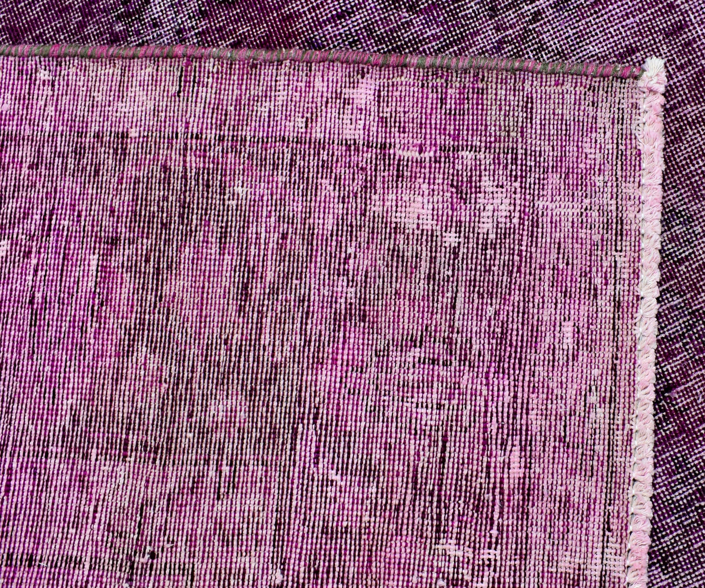 Edge detail of hand knotted overdyed Persian rug showing binding and authentic weave structure
