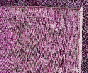 Edge detail of hand knotted overdyed Persian rug showing binding and authentic weave structure
