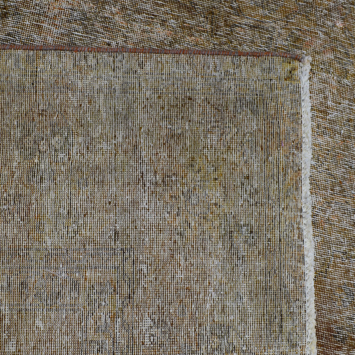Detailed pile texture of neutral overdyed Persian rug showing authentic wool foundation
