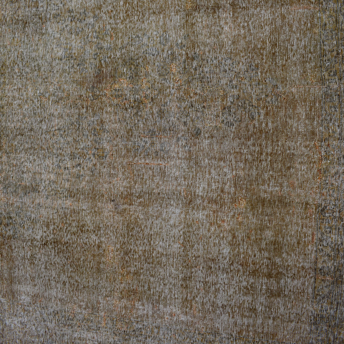 Edge detail of hand knotted overdyed Persian rug with visible binding and tonal depth

