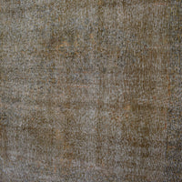 Edge detail of hand knotted overdyed Persian rug with visible binding and tonal depth
