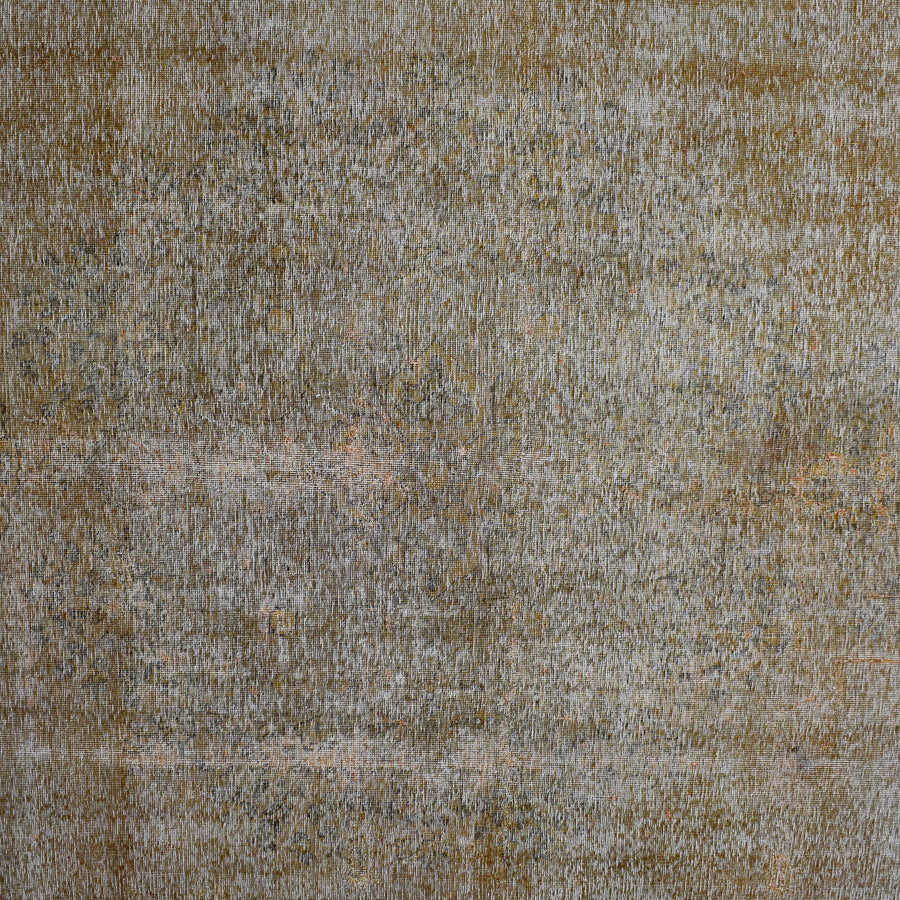 Close-up of overdyed vintage Persian rug showing textured wool pile and muted neutral tones
