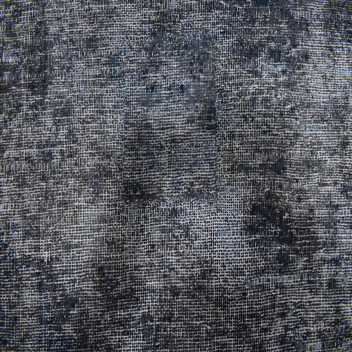 Backside of overdyed vintage Persian rug showing traditional hand knotted construction
